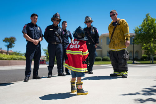 Firefighters and Child Dress as Fire Chief