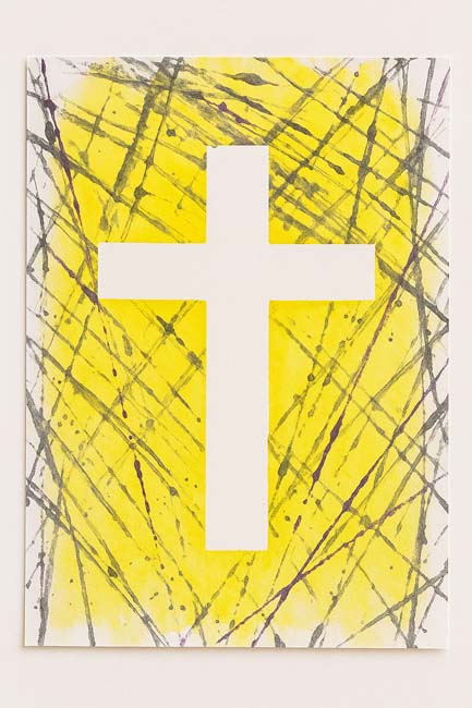 painter's tape resist cross craft done in a marble paint style